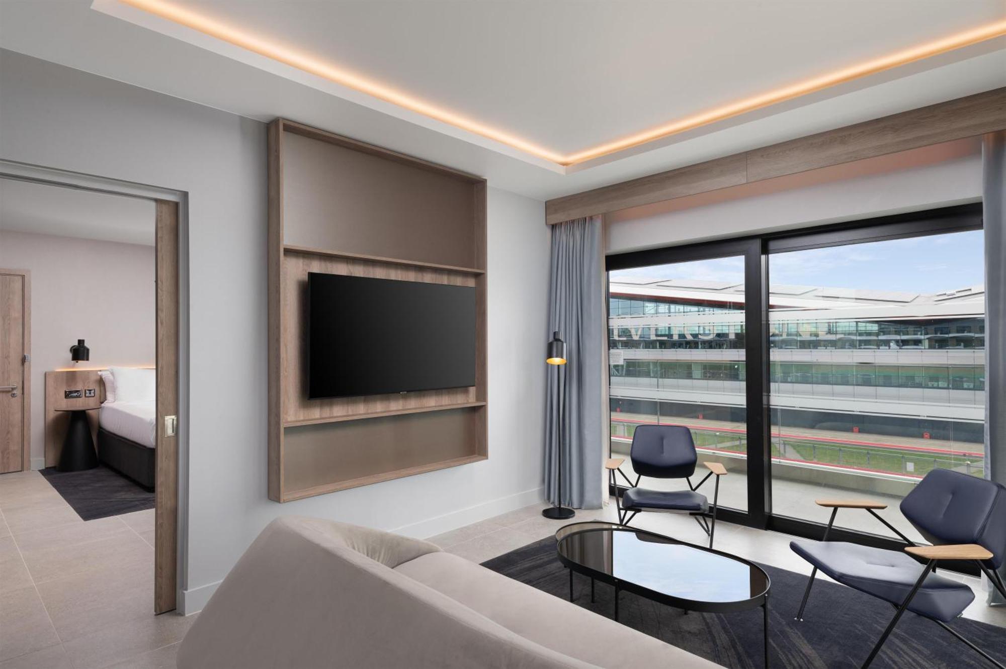 One Bedroom Suite with One King Bed and Balcony - Track Facing